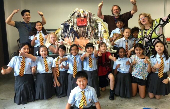 Jacha with orangutan sculpture created in collaboration with school students.