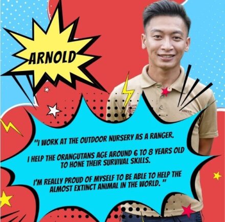 Orangutan Appeal UK staff member standing for a photo with comic book-style graphics surrounding them.