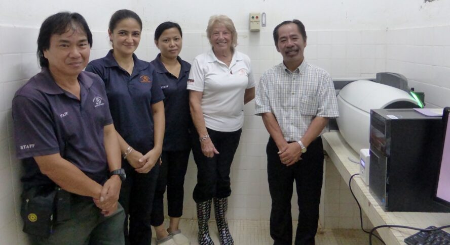 Sepilok and Orangutan Appeal UK team standing next to clinic equipment.