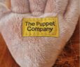 Orangutan puppet foot with tag reading 'The Puppet Company'