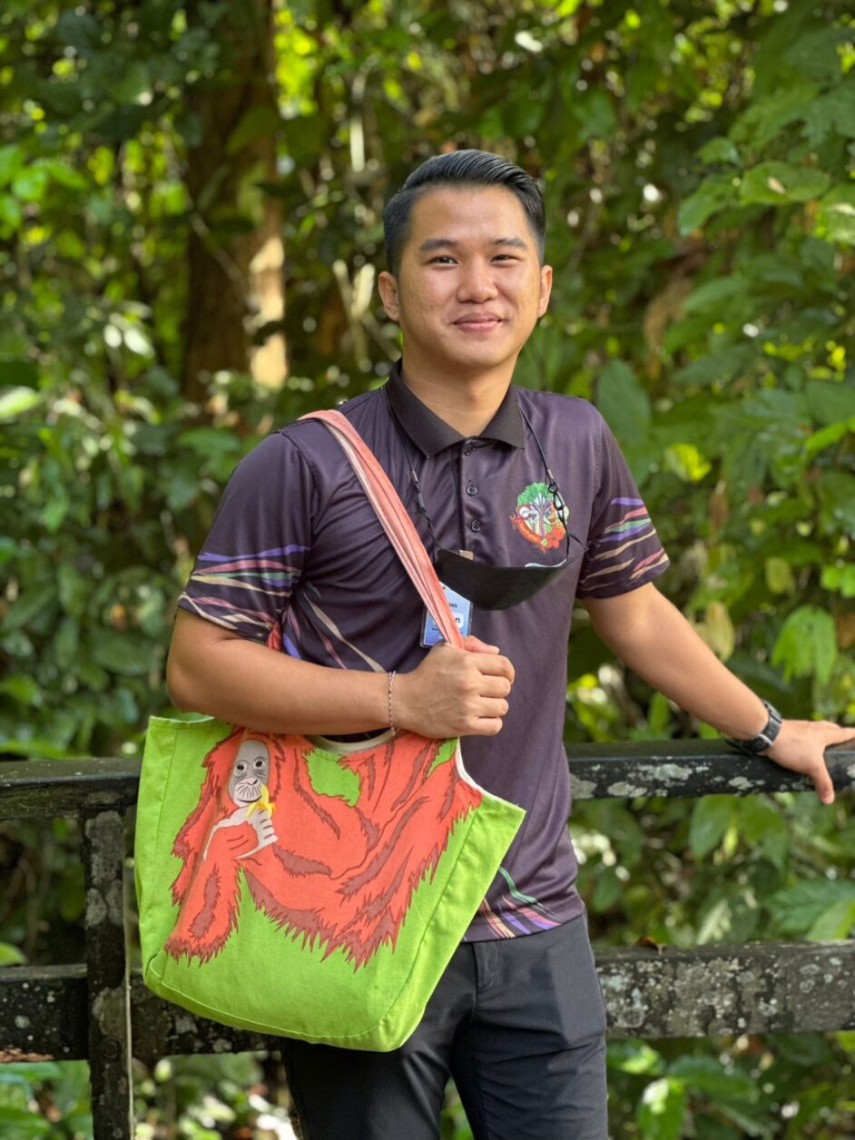 Sepilok team member using orangutan shoulder bag.