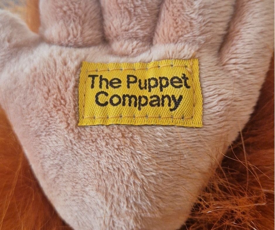 Orangutan puppet foot with tag reading 'The Puppet Company'